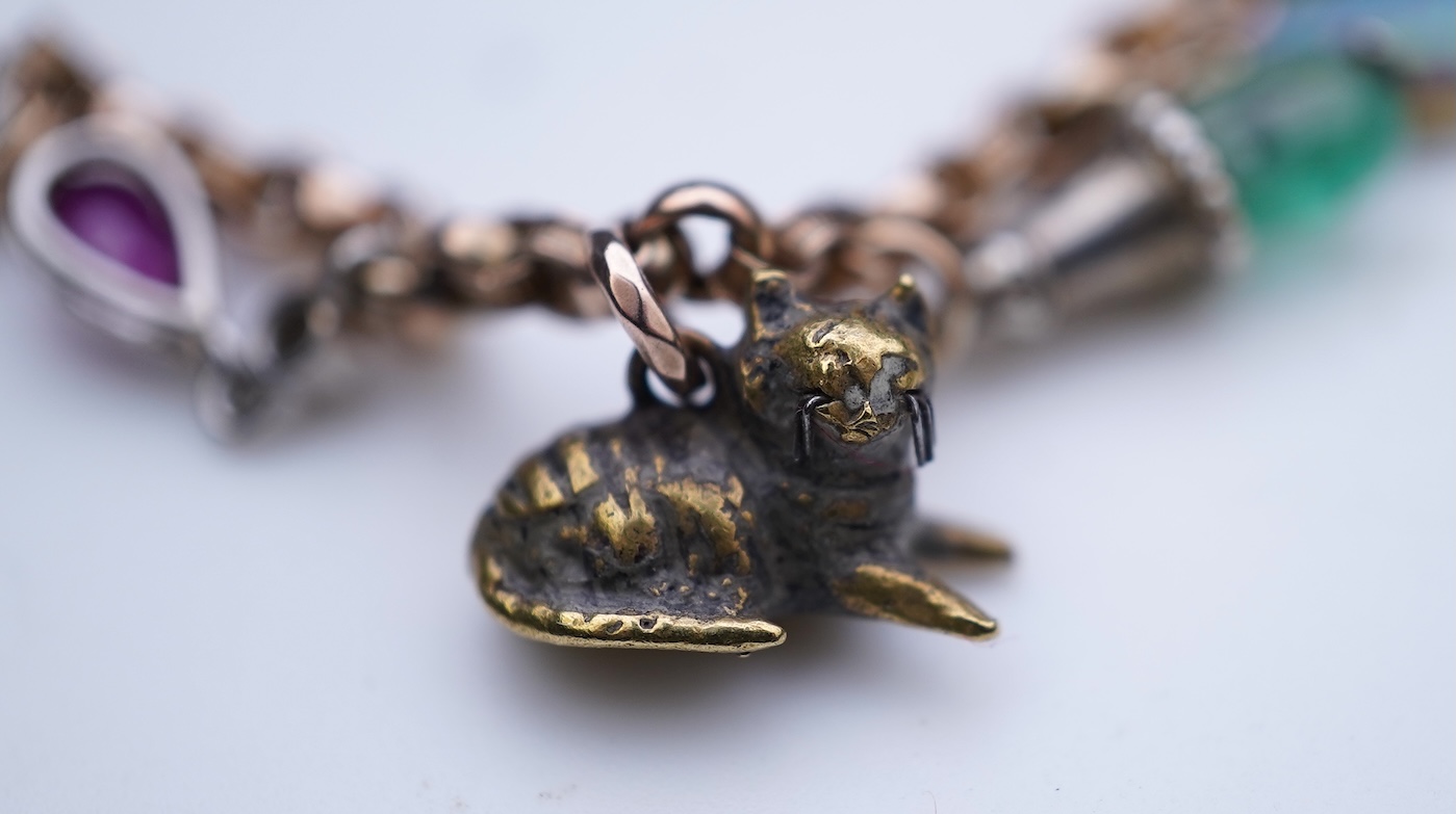 A gem-set charm bracelet, late 19th-early 20th century